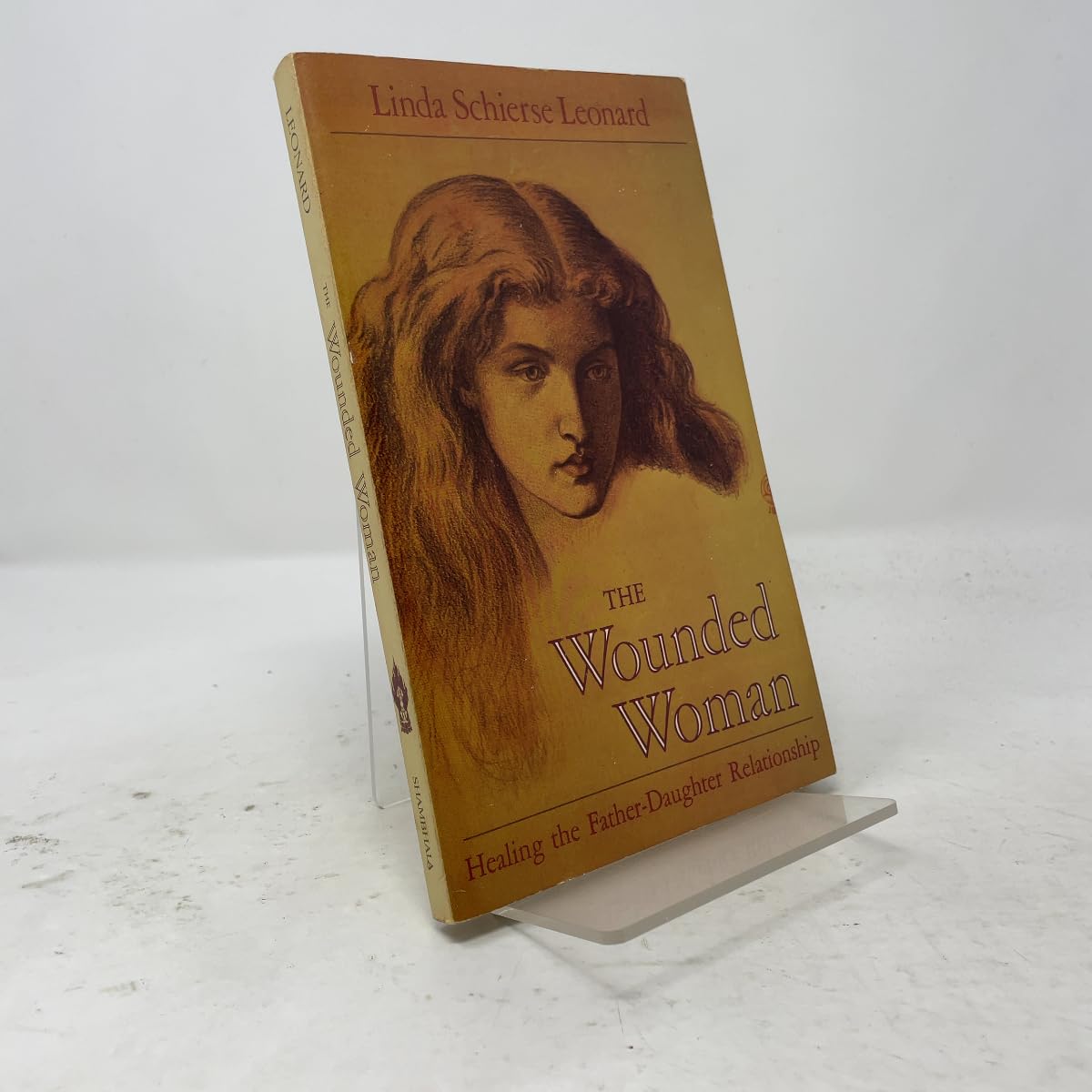 The Wounded Woman: Healing the Father-daughter Relationship by Leonard, Linda Schierse (1991) Paperback book cover