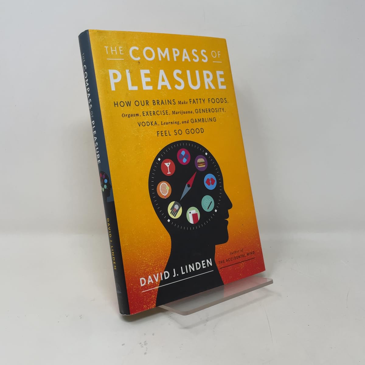 Compass of Pleasure: How Our Brains Make Fatty Foods, Orgasm, Exercise, Marijuana, Generosity, Vodka, Learning, and Gambling Feel So Good book cover