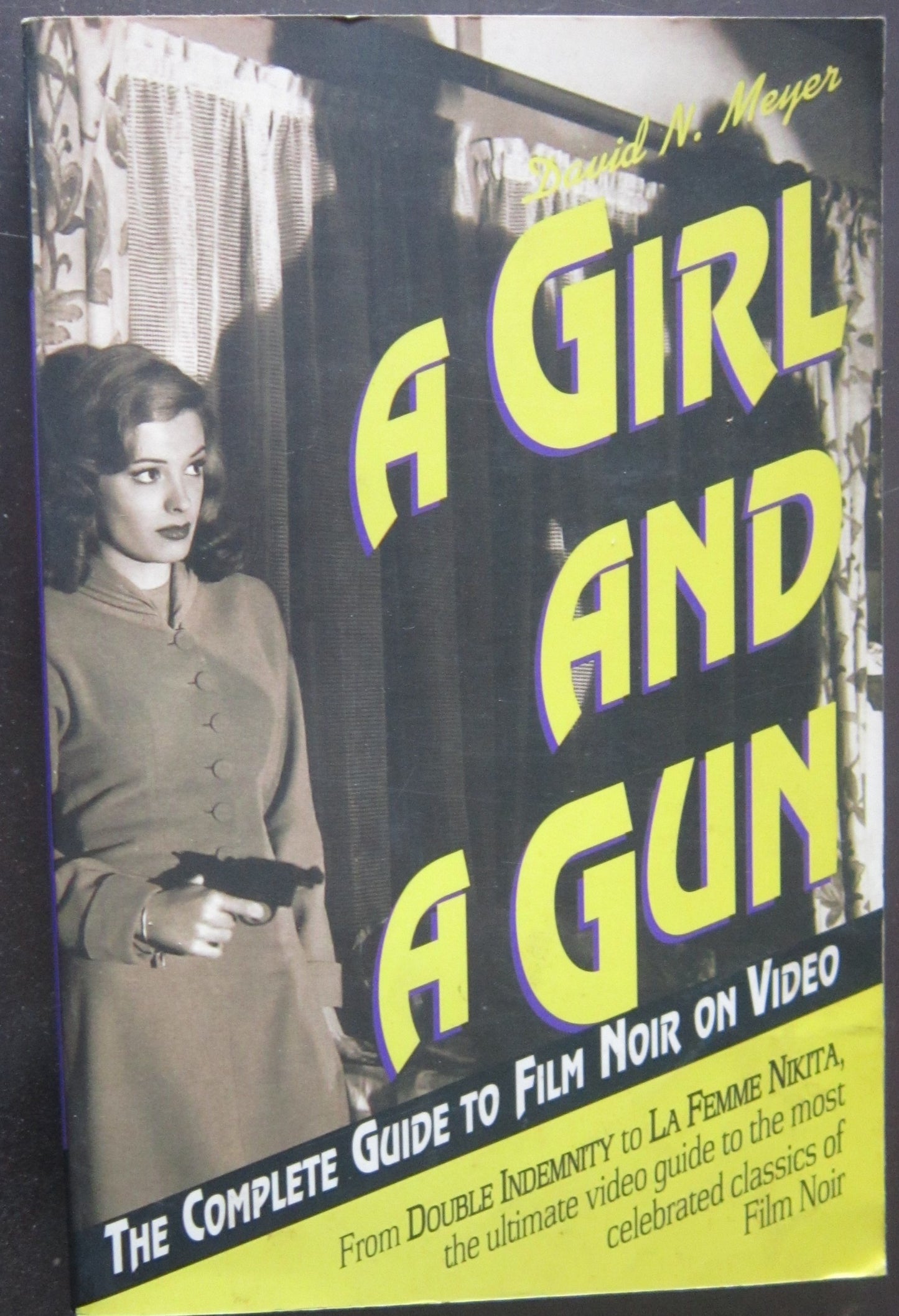 Girl and a Gun: The Complete Guide to Film Noir on Video book cover