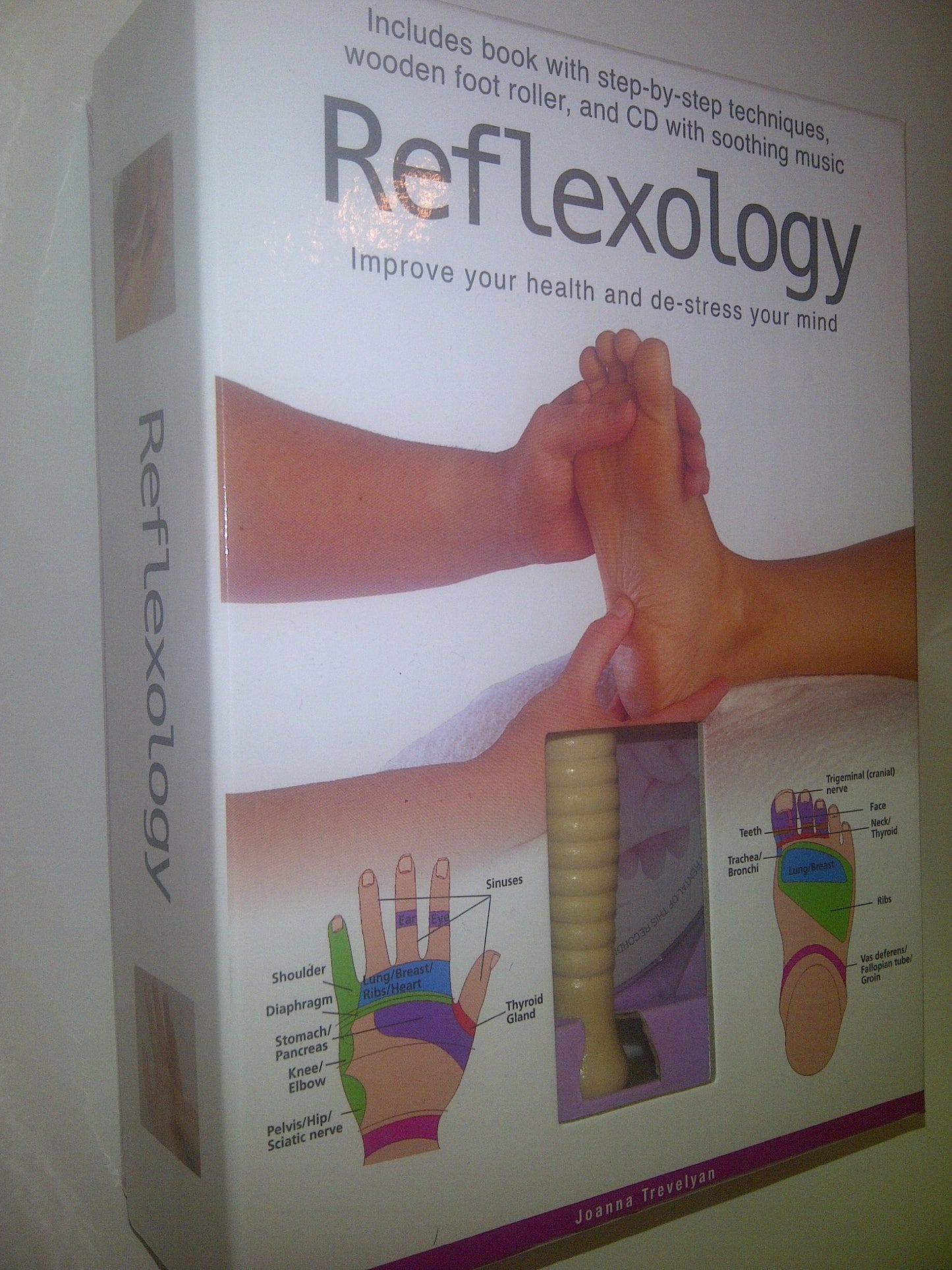 Reflexology: Improve Your Health and De-stress Your Mind: Box set includes book with step-by-step techniques, wooden foot roller, and CD with soothing music. book cover