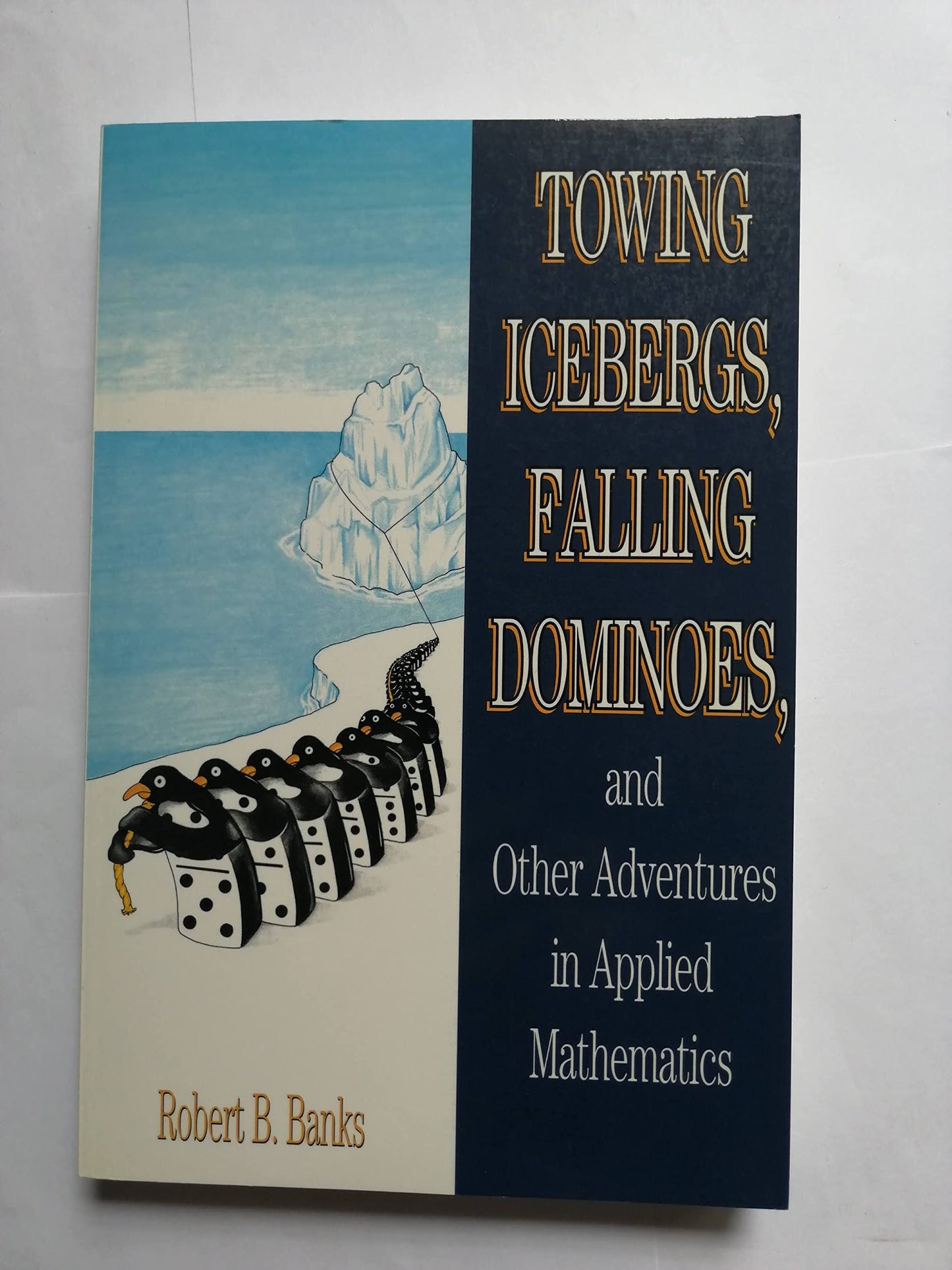 Towing Icebergs Falling Dominoes: And Other Adventures in Applied Mathematics book cover
