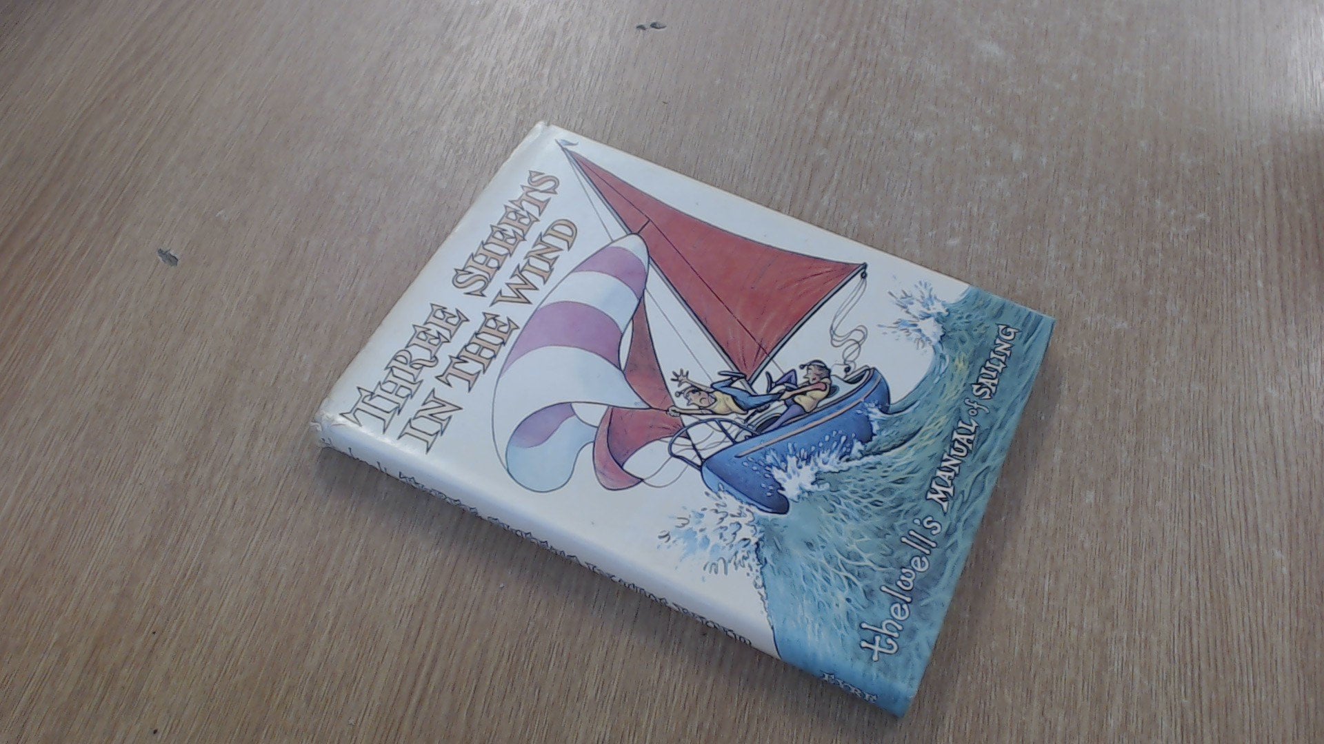 Three sheets in the wind;: Thelwell's manual of sailing book cover