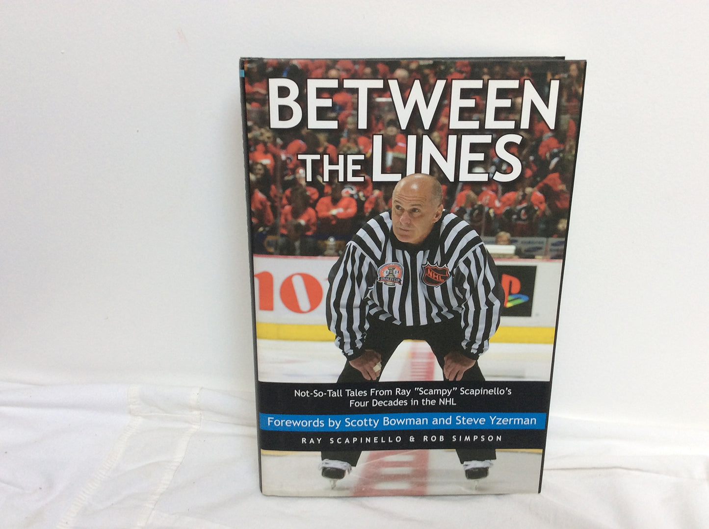 Between the Lines: Not-So-Tall Tales from Ray "Scampy" Scapinello's Four Decades in the NHL book cover